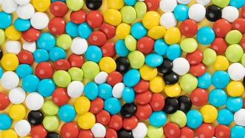Background of multi-colored dragees, candy close-up Stock Photos
