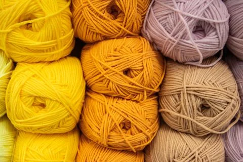 Background from multi-colored fluffy woolen threads for knitting. Stock Photos