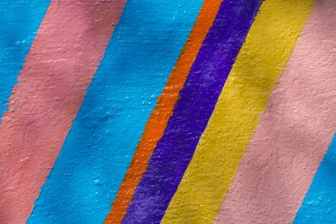 Background from multi-colored stripes painted with paint. Stock Photos