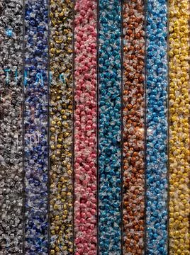 Background from multi-colored sweets. Sweets sorted by color. Stock Photos