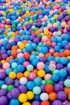 Background of multicolored balls. Children's play pool. Stock Photos