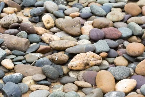 Background of multicolored pebbles Stock Photos