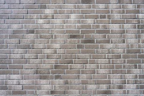 Background from a new grey brick wall Stock Photos