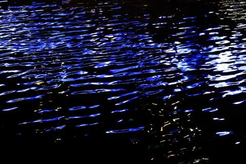 Background from the night river and reflected lights of the big city Stock Photos