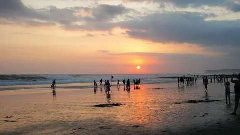 In the background of the ocean at sunset in the rays of the sun leaving the Stock Footage 205588527