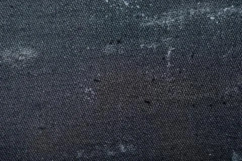 Background of an old black cloth Stock Photos
