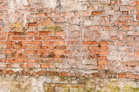 The background of an old brick crumbling wall Stock Photos