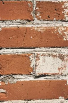 Background old broken brown-yellow brick wall Stock Photos