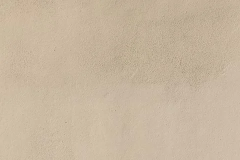 Background of old brown ochre plaster wall in detail Stock Photos