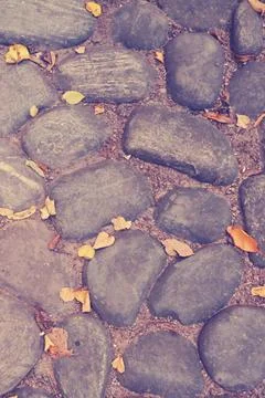 Background of the old cobblestone path, surface texture of large rocks with a 스톡 사진