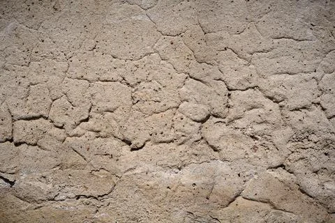 Background of old cracked wall with rough cement surface Stock Photos