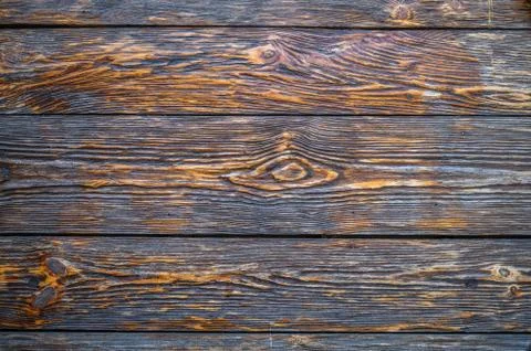 Background of old dark brown textural boards with knots Stock Photos