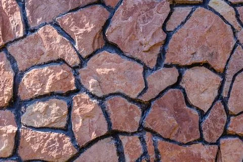 Background of old granite stone wall Stock Photos