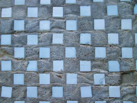 Background from an old gray uneven wall of a residential building. Foto stock