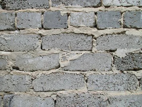 Background from an old gray wall made of bricks. Foto stock