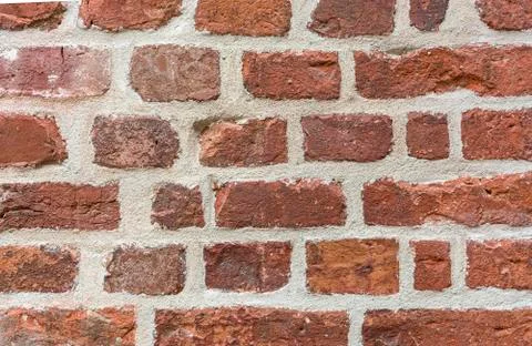 Background old masonry of red brick. Plaster, concrete, cement. Cracks, peeling Foto stock