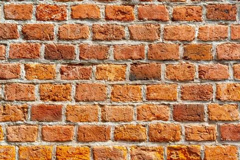 The background of the old red brick wall for design interior The backgroun... Stockfoto's