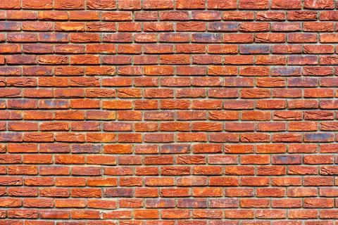 The background of the old red brick wall for design interior The backgroun... Stockfoto's