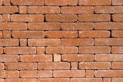 Background of old red brown bricks in horizontal display Stock Photos
