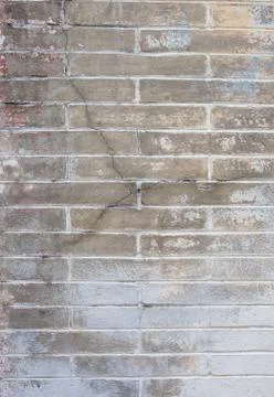 Background with old rough antique brick wall terracotta brick with cracks and Stock Photos