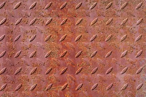 Background of old, rusty iron sheet with notches Stock Photos