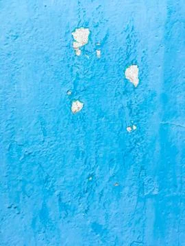 Background of an old wall covered in blue paint. Grunge texture. Stock Photos