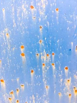 Background of an old wall covered in blue paint. Rusty metal surface. Grunge  Stock Photos