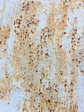 Background of an old wall covered in blue paint. Rusty metal surface. Old tex Stock Photos