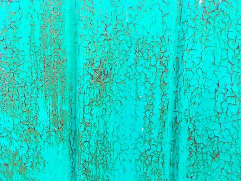 Background of an old wall covered in green paint. Rusty metal surface. Old te Stock Photos