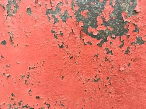 Background of an old wall covered in red paint. Rusty metal surface. Stock Photos
