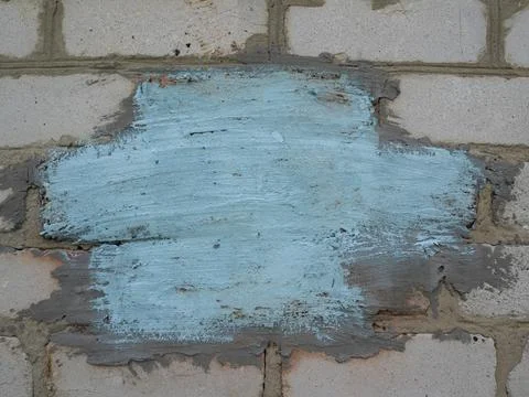 Background of an old wall of white blocks with a blue-colored place for your  Stock Photos