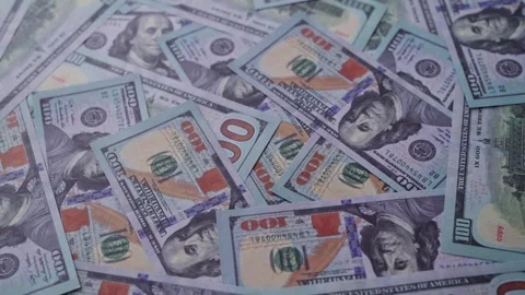 Background of one hundred US dollar bills scattered randomly. Stock Footage 338337138