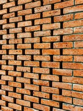 Background or backdrop of brown brick wall texture. Lattice brown brick wal.. Stock Photos