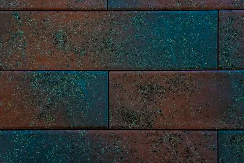 Background or backdrop of two-tone clinker brick. Texture of green ceramic brick Stock Photos