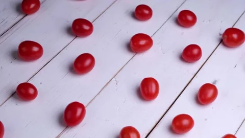 Background or composition of rotating cherry tomatoes on white wooden boards Stock Footage 167521657