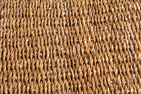 Background or texture of braided cattail, brown color, copy space. Stock Photos