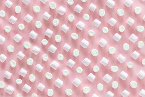 Background or texture of pink and white mini marshmallows on pink background Stock Photos