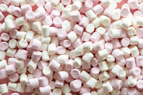 Background or texture of pink and white mini marshmallows on pink background Stock Photos