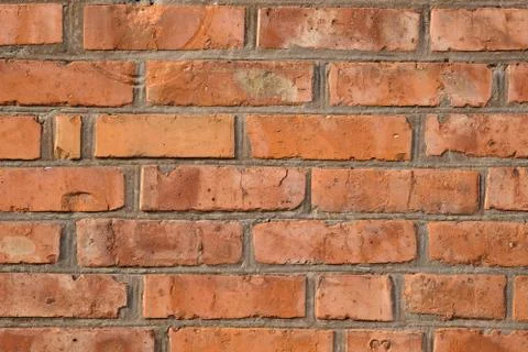 Background of orange bricks. Brown old brick wall. Stock Photos