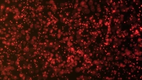 Background of orange particles from which a glow emanates. Mesmerizing bokeh Stock Footage 308147800