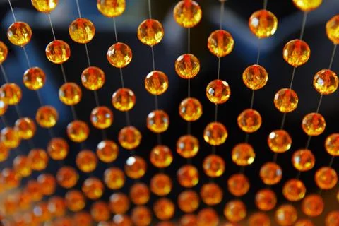 Background of orange round beads on strings Stock Photos