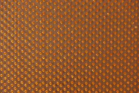 Background of orange round beads on strings Stock Photos