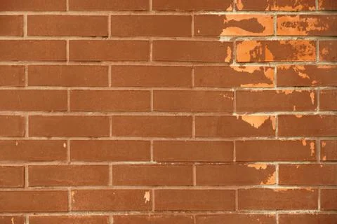 Background of ordinary brown brick wall with scrapes paint Stock Photos