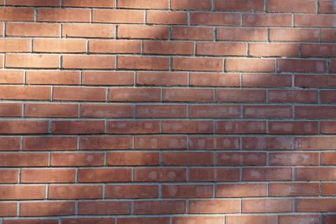 Background of ordinary red brick wall. City background Stock Photos