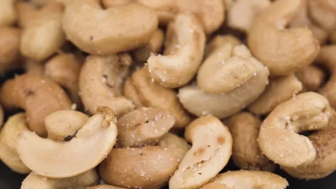 Background of organic cashew nuts, roasted salted cashew for snack, healthy eati Video stock 308927543