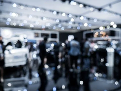 Background is out of focus and blurred at the auto show. Stock Photos