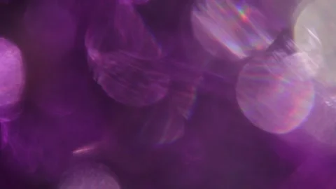 Background overlay made from a sparkling prismatic purple bokeh light effect 스톡 동영상 318944704