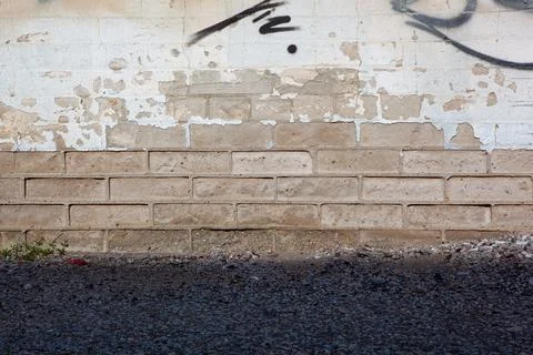 Background of partial painted white brick wall with peeling texture Stock Photos