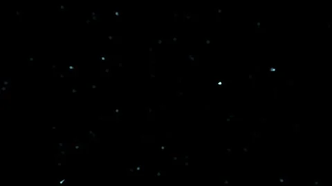 A background of particles flying towards the viewer, featuring light partic.. Video stock 264597254