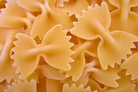 Background of paste in the form of bows closeup. Stock Photos